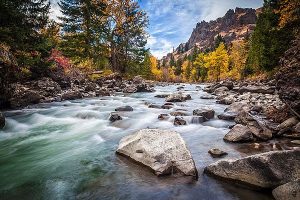 Rocky river by mountains